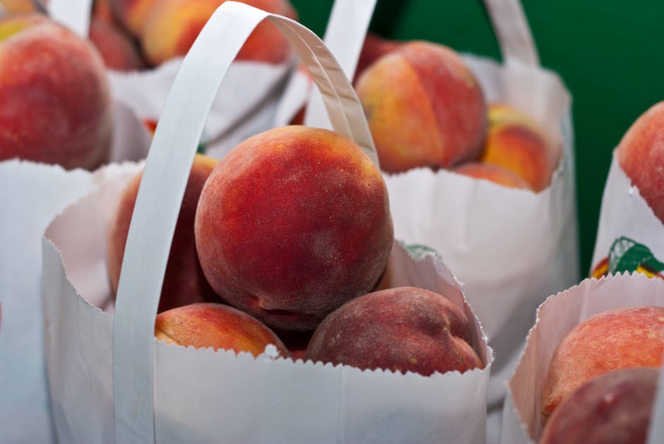 You can peel peaches by boiling them in water and then taking an ice bath.